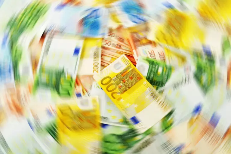 Compliance with Federal Corporate Transparency Act: Euro banknotes in motion stock photo.